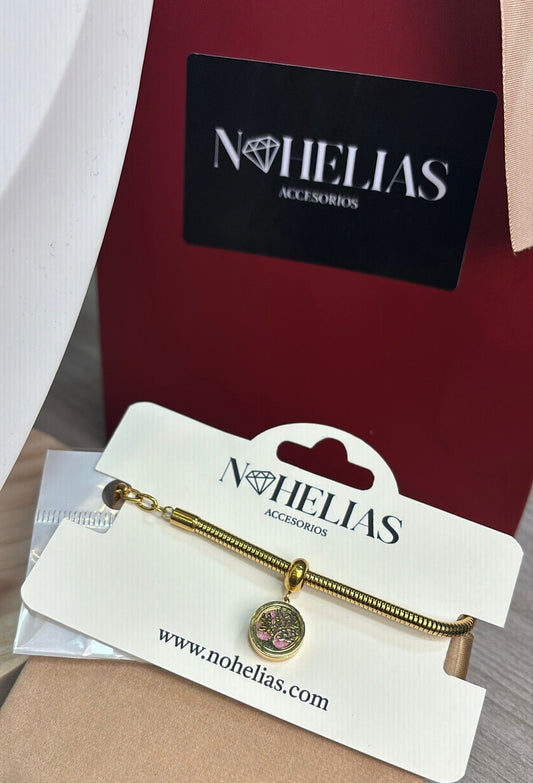 Pulsera arbol dorado fondo rosa